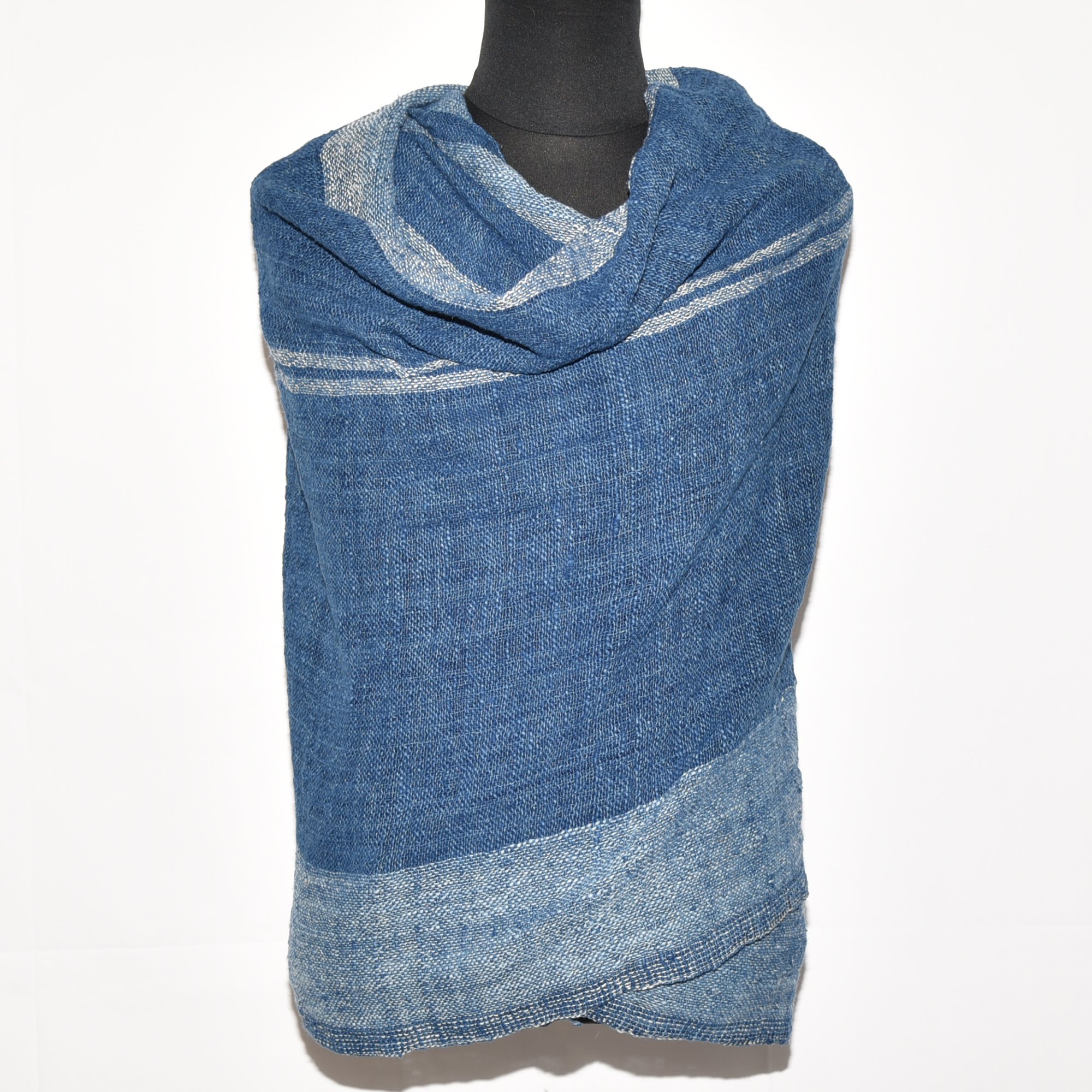 Hand-spun, hand-dyed, and hand-woven indigo and white striped organic cotton shawl with tassels, measuring 2m x 80cm.