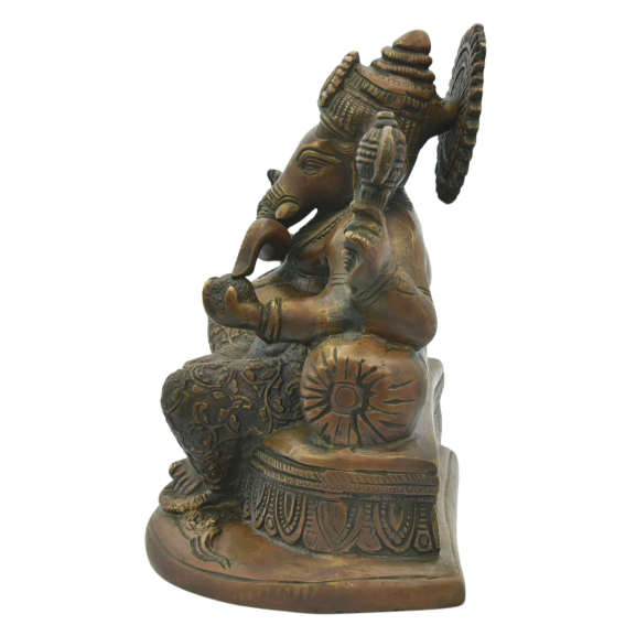 "Close-up of a hand-cast brass Ganesha statue featuring a rich antique bronze finish and intricate traditional carvings