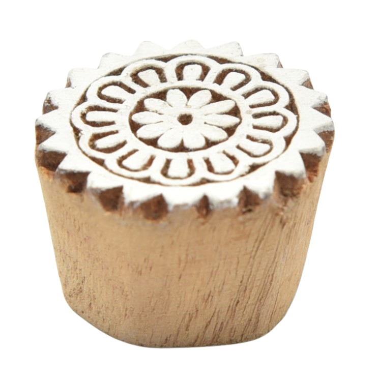 Small, hand-carved wooden Indian printing blocks featuring floral designs.