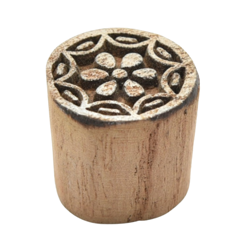 Small, hand-carved wooden Indian printing blocks featuring floral designs.