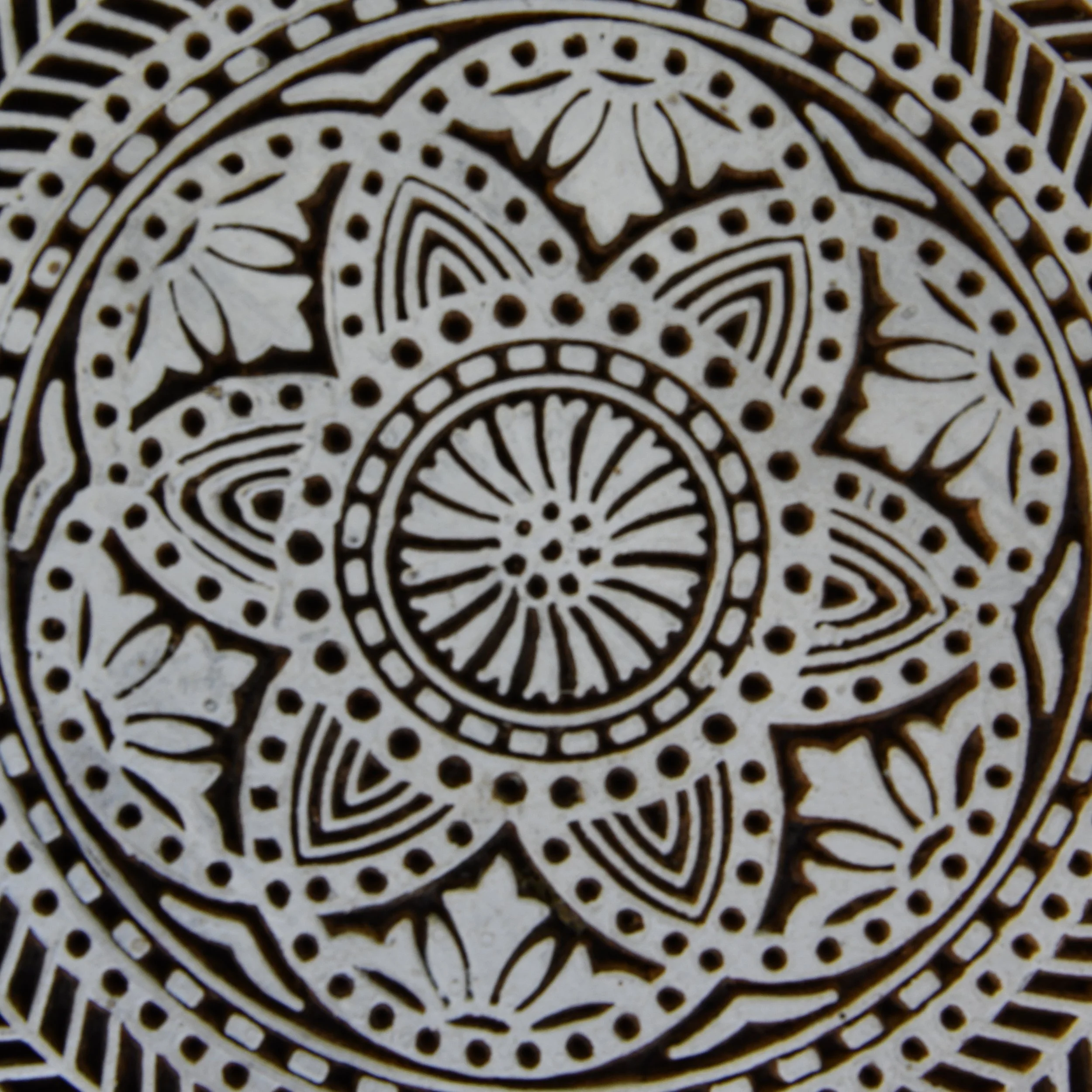 Large, hand-carved Indian wooden printing block with a detailed mandala design