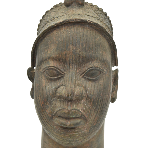 Detailed bronze sculpture of a woman's head with a crown, depicting an Ife Queen from Benin's rich cultural heritage.