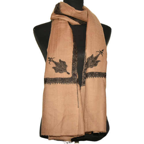 Light brown Kashmir shawl with black edging on tailors dummy.png