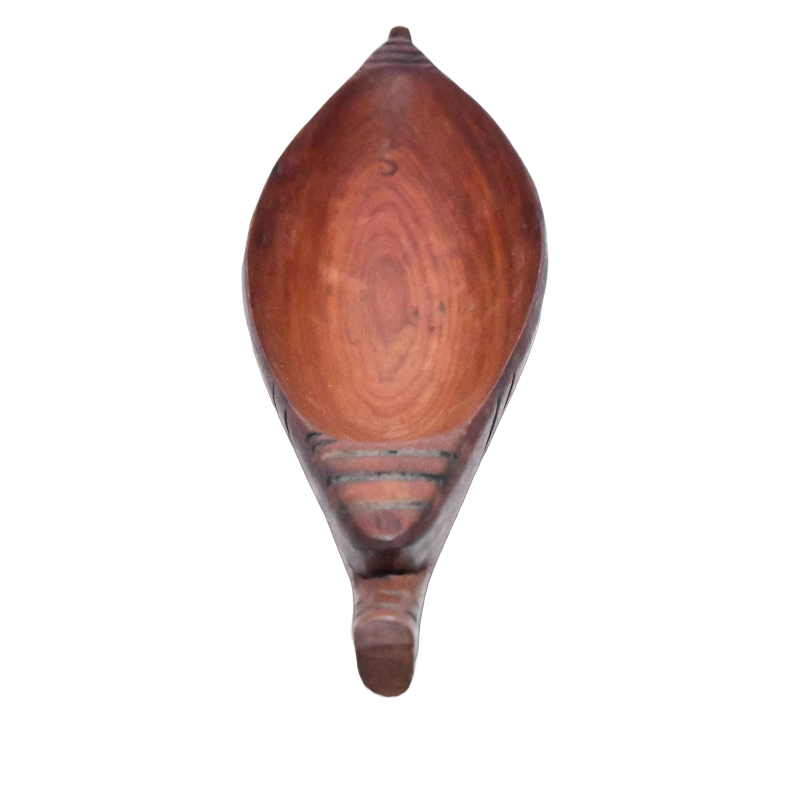 top view of african wooden boat statue.png