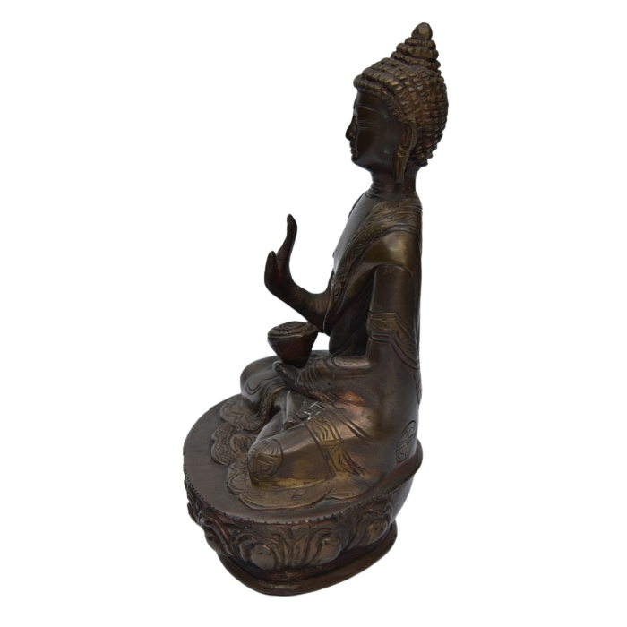 Antique brass Medicine Buddha statue 18cm tall looking west.png