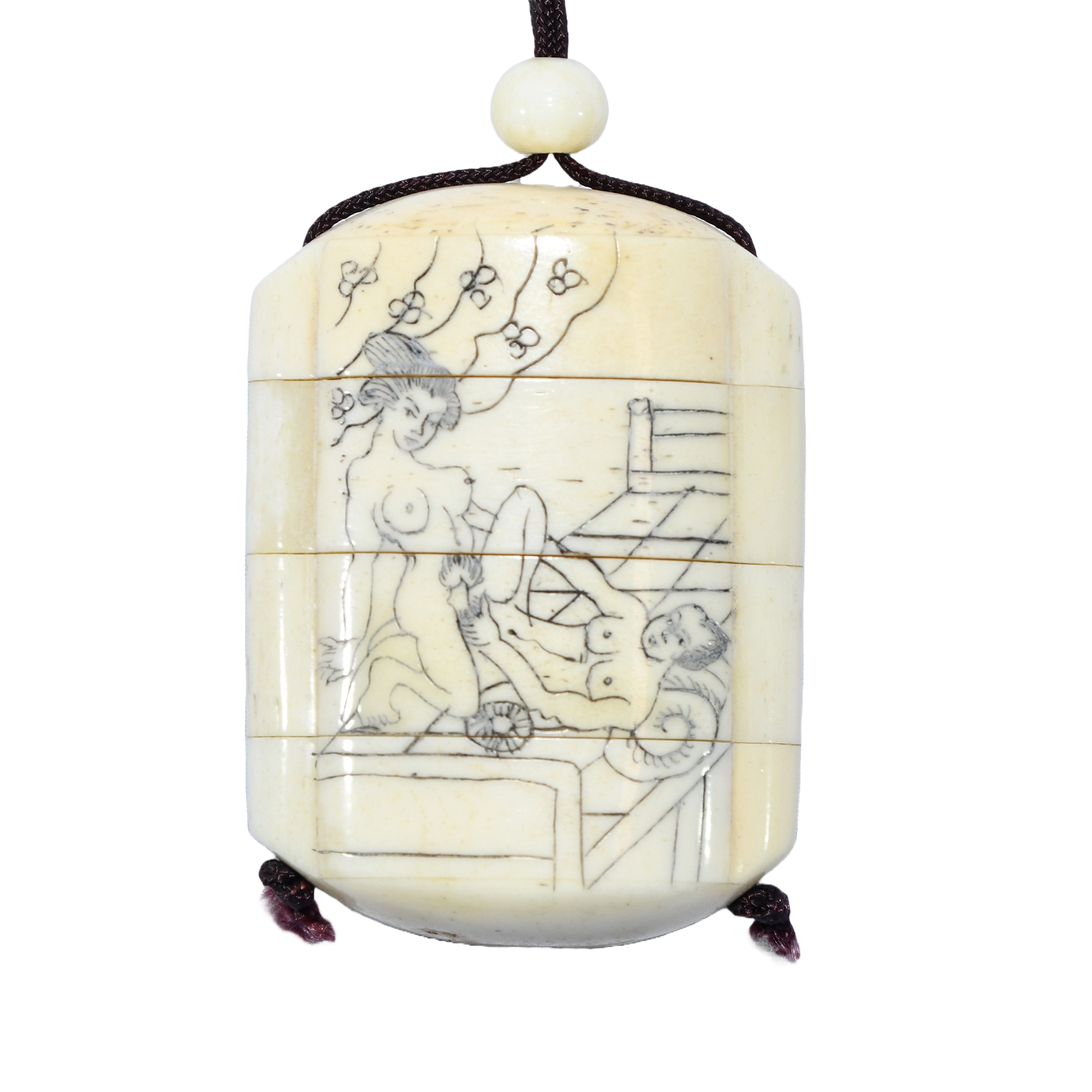 19th-century Japanese inro with erotic carvings, accompanied by an early-20th-century boxwood oni netsuke.