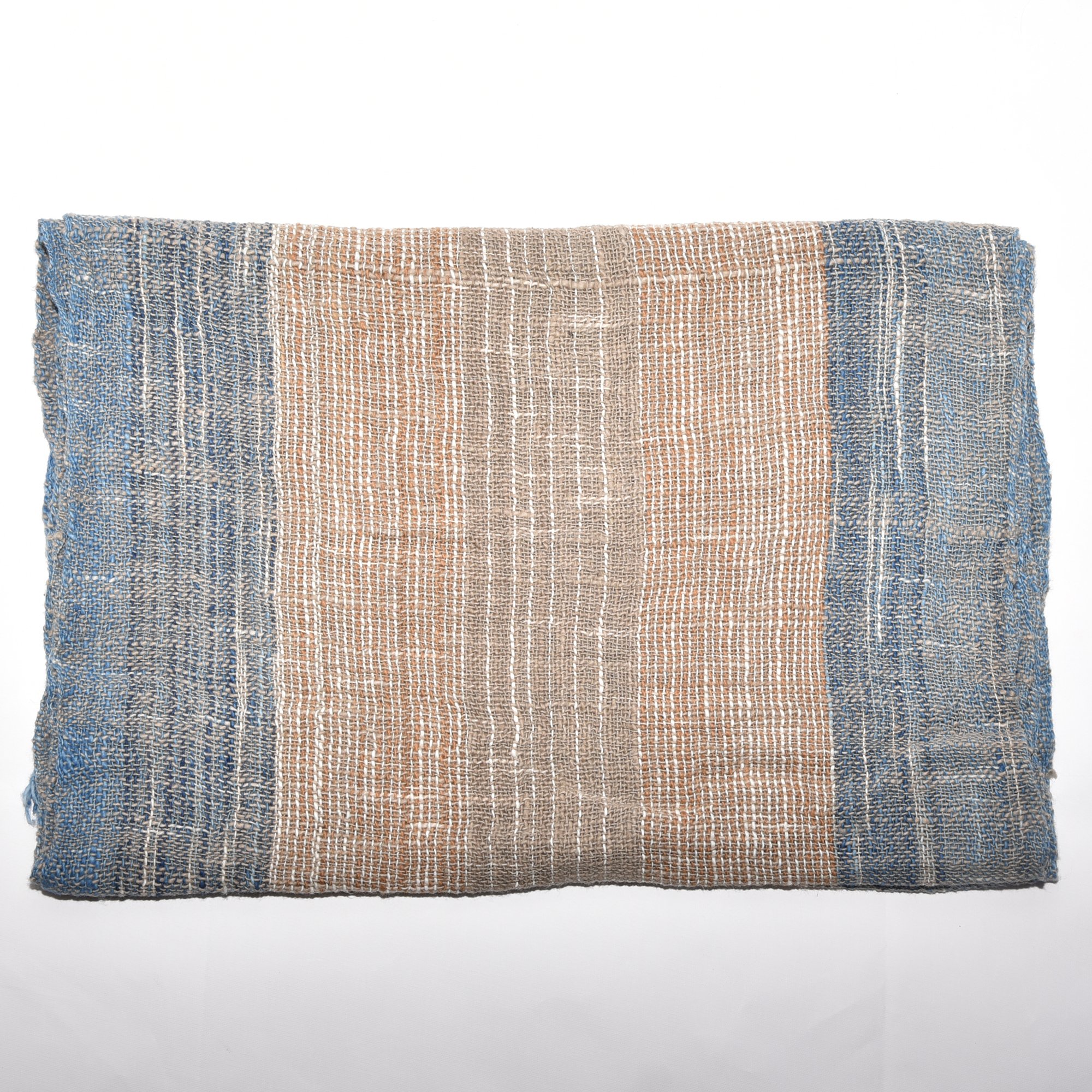 Hand-spun, hand-dyed, and hand-woven organic cotton scarf with brown, tan, indigo, and white stripes and tassels.