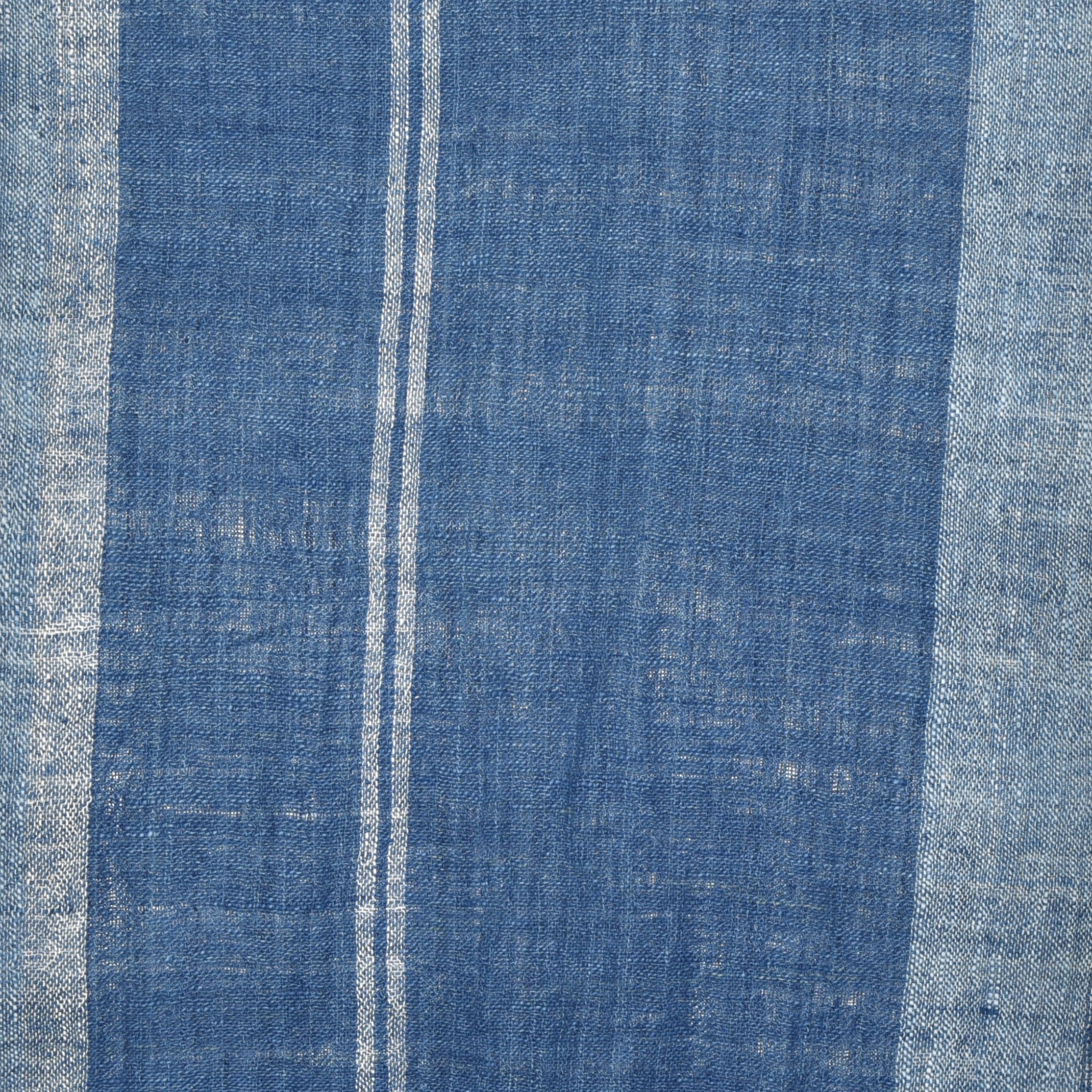 Hand-spun, hand-dyed, and hand-woven indigo and white striped organic cotton shawl with tassels, measuring 2m x 80cm.