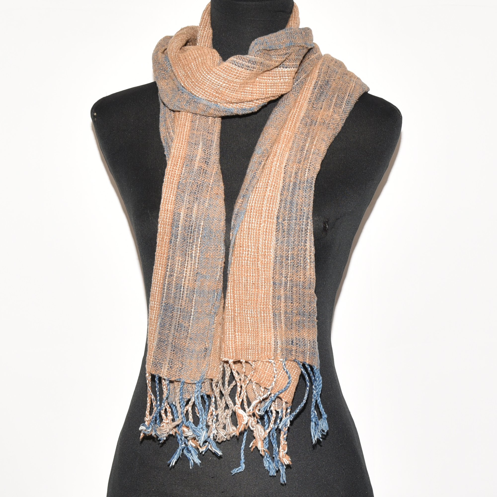 Hand spun, hand dyed and hand woven thick organic cotton striped scarf with brown, tan, indigo, and white, with tassels at each end. Measures 2m x 38cm.