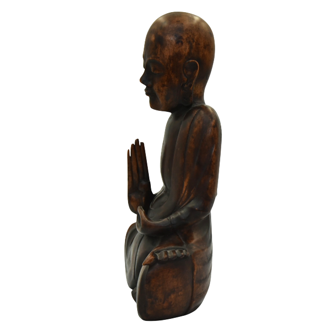 wooden seated buddha looking left.png