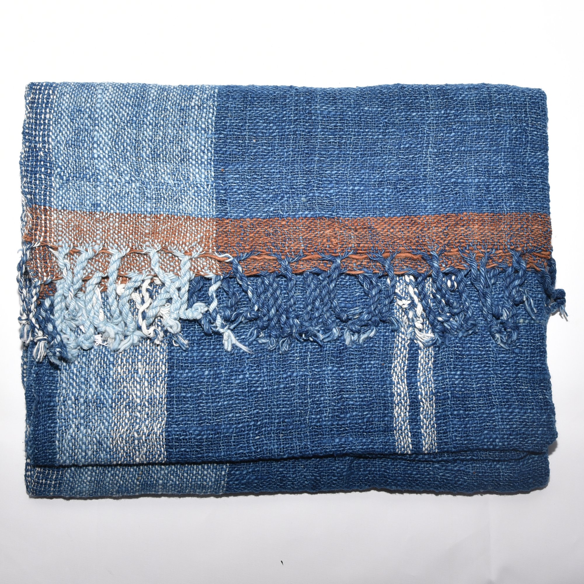 Hand-spun, hand-dyed, and hand-woven indigo and white striped organic cotton shawl with tassels, measuring 2m x 80cm.