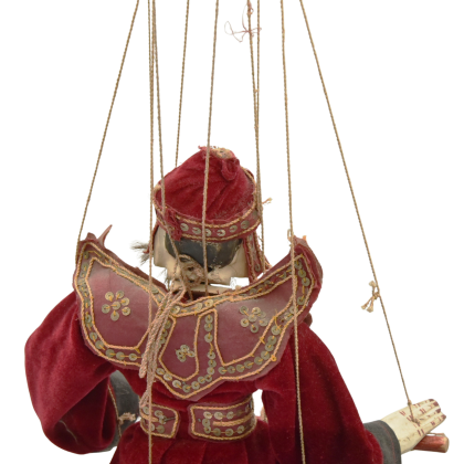 Front view of an antique burmese puppet close up.png