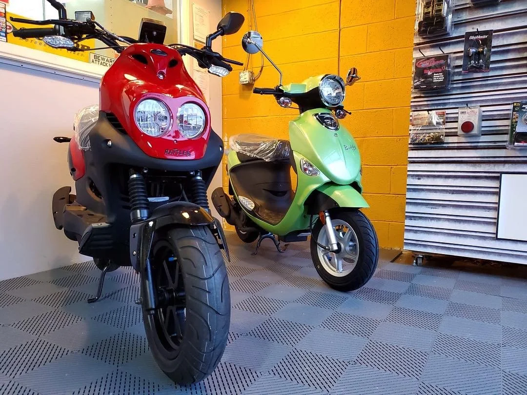 Scooters on display at the front with the Swisstrax flooring