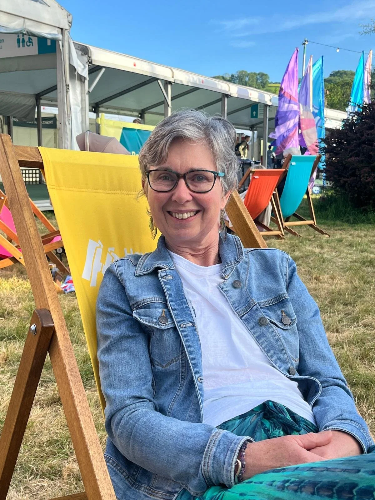 Carol Usher at hay Festival, sitting in a deck chair