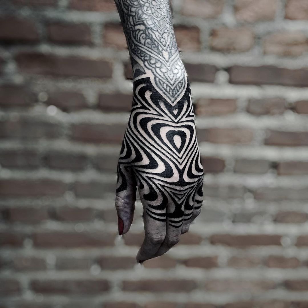An ornamental black and grey hand tattoo tattoo by Thiago Benevides, featuring flowing patterns and fine line details. Custom tattoo designs in Lisbon, Portugal
