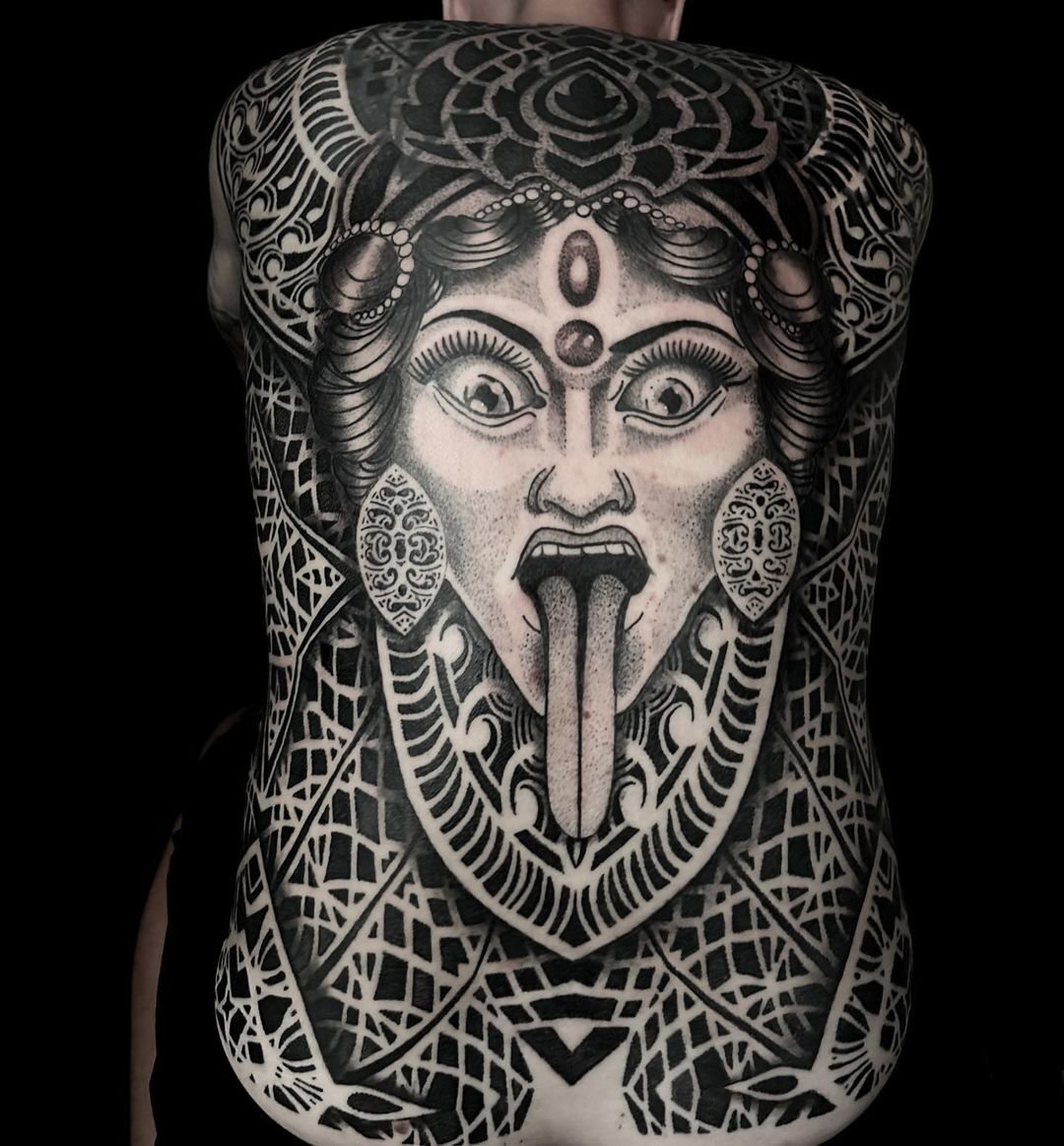 Full back cover-up tattoo by Thiago Benevides in Lisbon, Portugal – black and grey geometric design concealing an old tattoo."