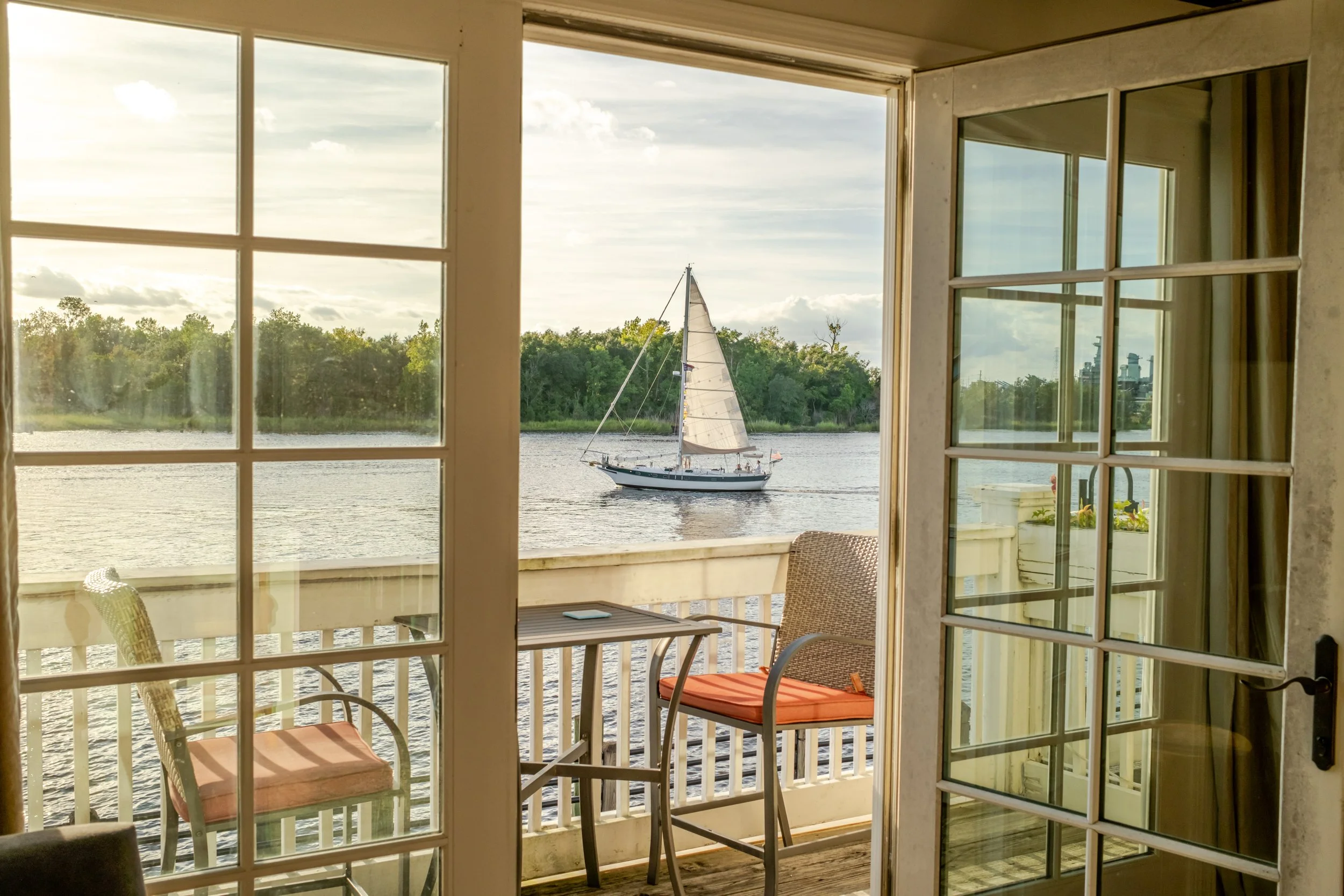 a sailboat is outside an Airbnb window