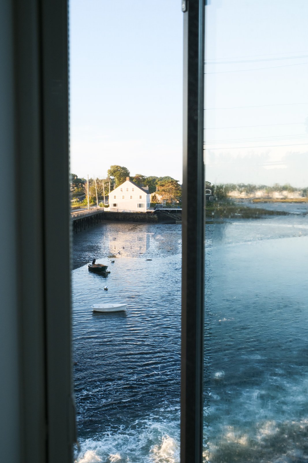 Airbnb window to ocean with text that says "Consistent Bookings"