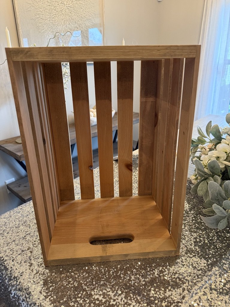 Wooden crate on a sequined table
