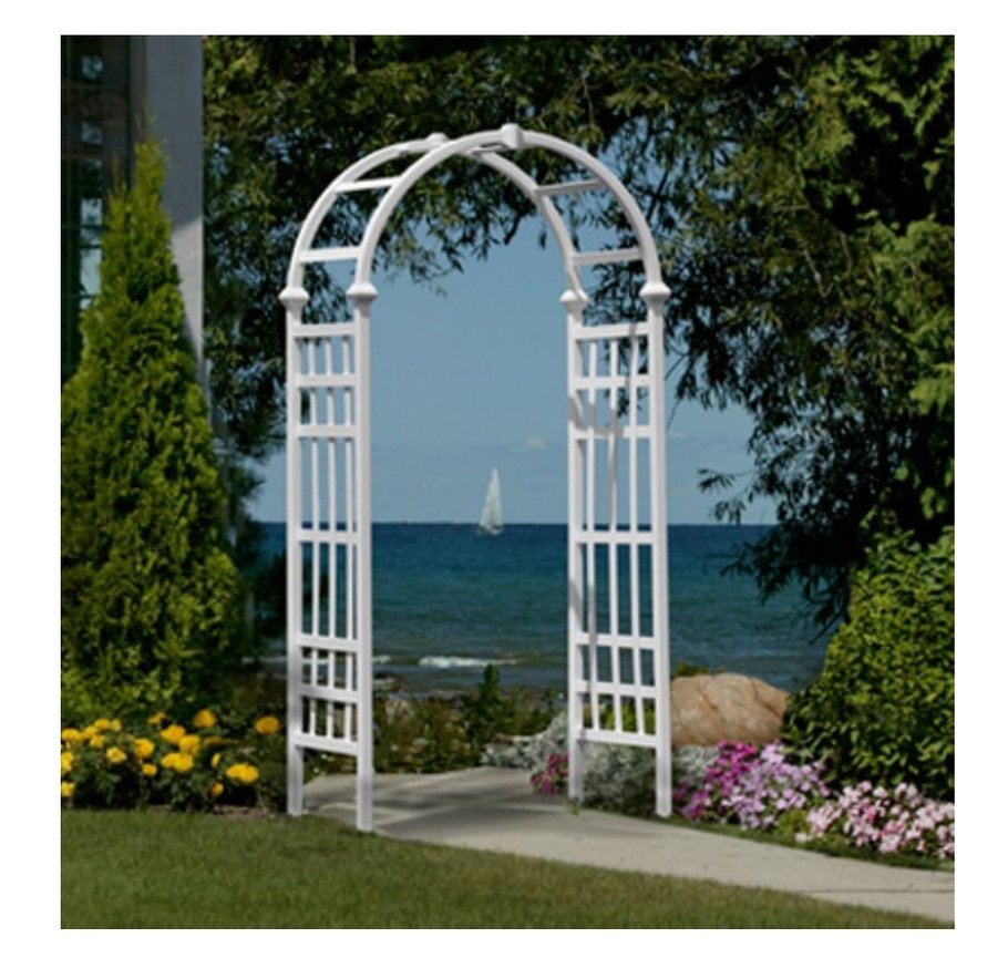 White garden arbor with sea view background