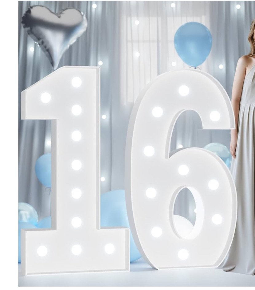 Illuminated number 16 prop with balloons, heart-shaped balloon in a party setting.