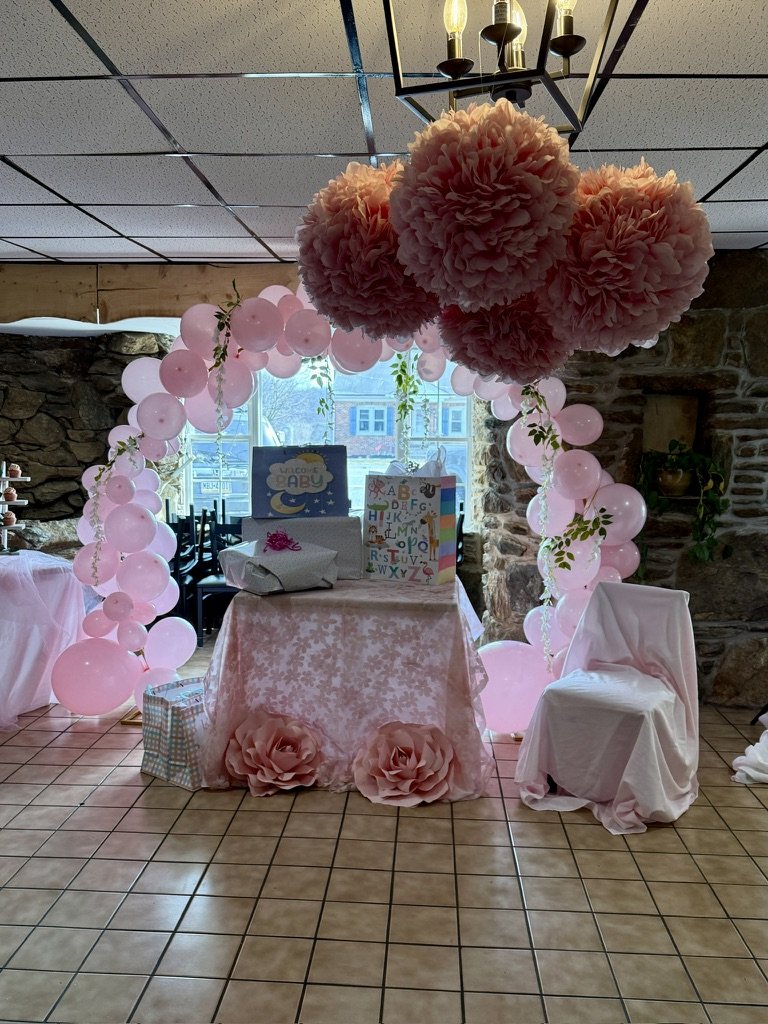 Baby shower setup with pink decorations