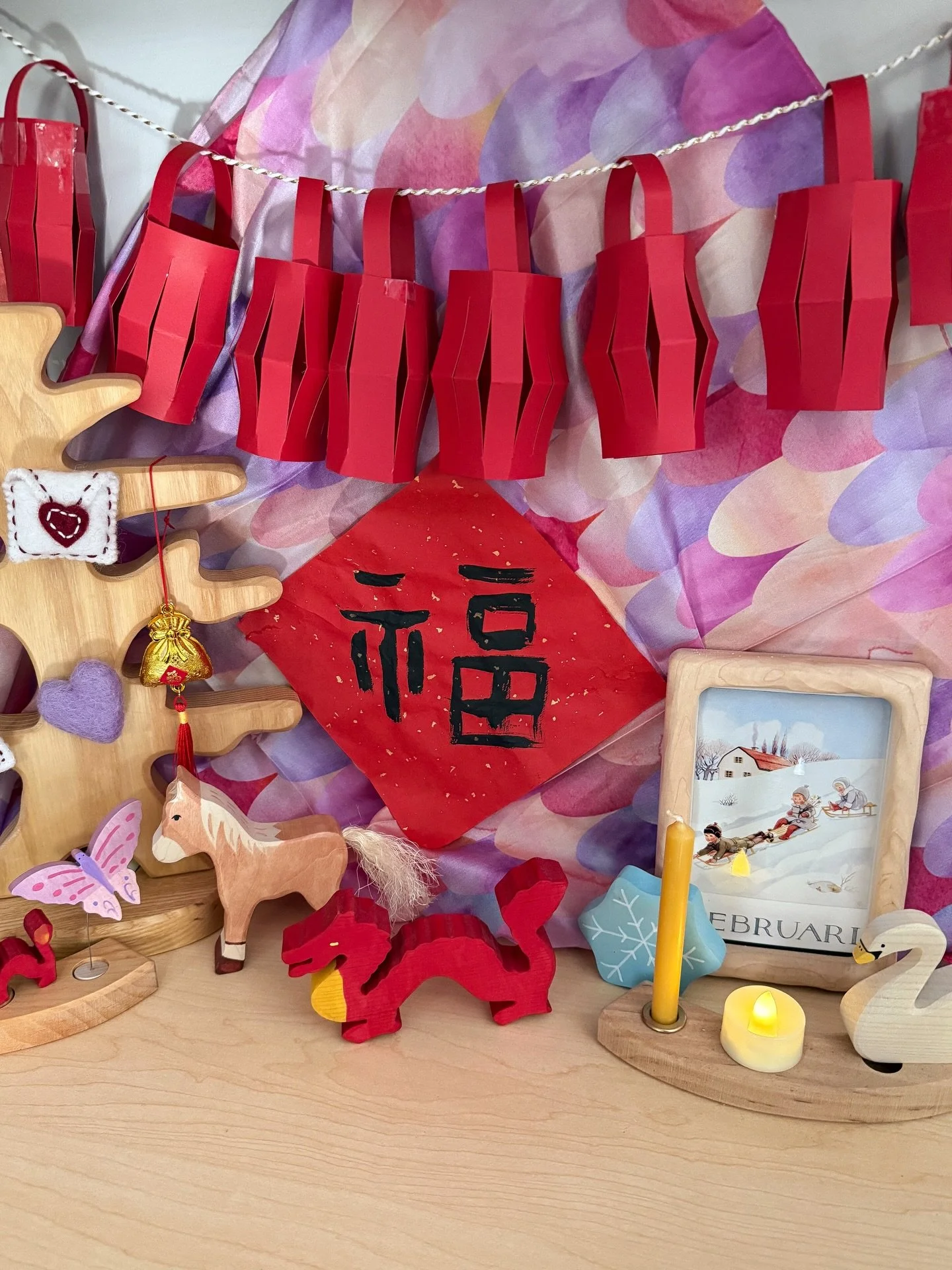 Our seasonal table has sort of a Lunar New Year - Valentine&rsquo;s Day thing going on 💌🧧

We made the Chinese New Year banner at a library event a couple years ago! Fun fact- I took one year of Mandarin in college but I don&rsquo;t remember much! 