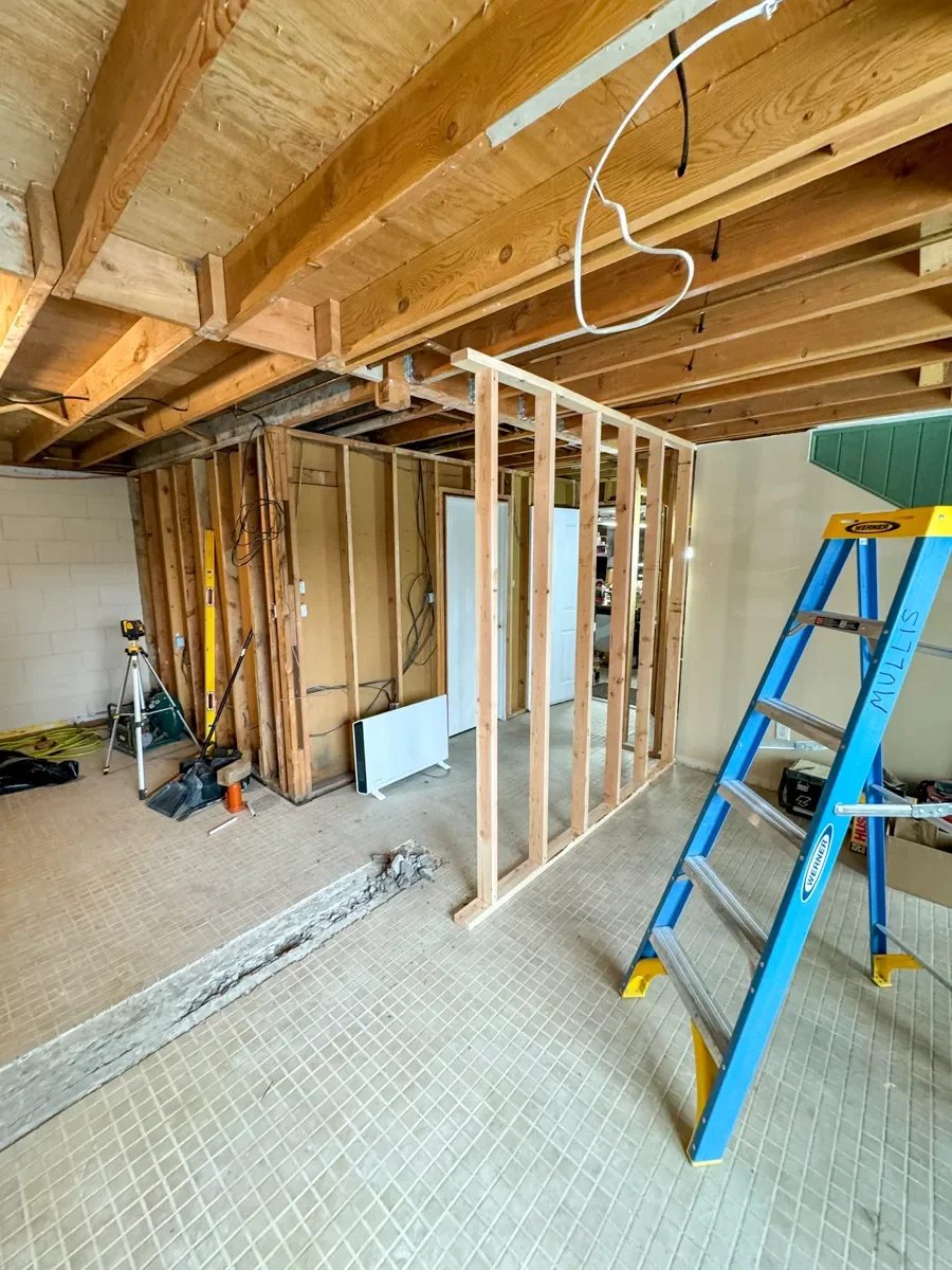 Basement remodel progress photo of wall and tile demo in Seven Hills, Boulder, CO