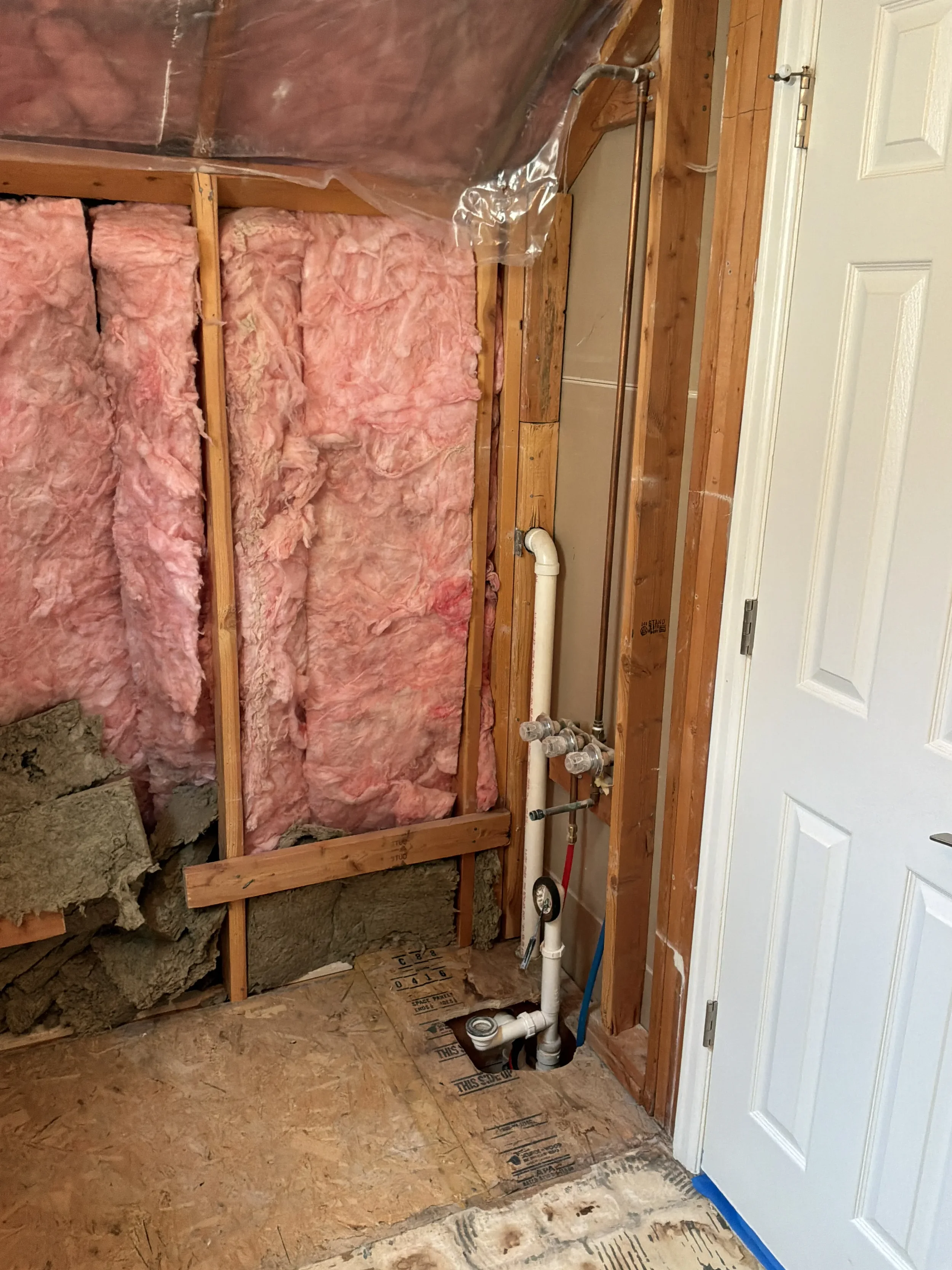 New insulation install in a Boulder, CO bathroom in the process of being remodeled by Downy Home Remodeling