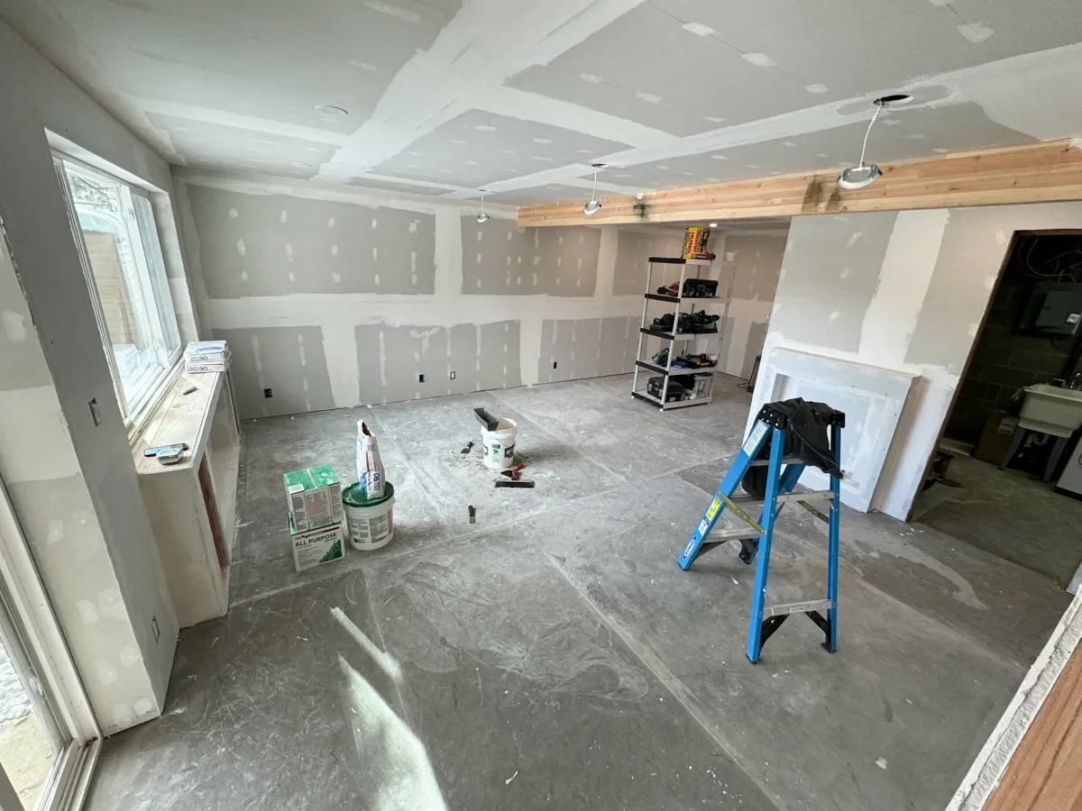 Boulder, CO basement remodel featuring full unfinished drywall installation and leveled concrete flooring