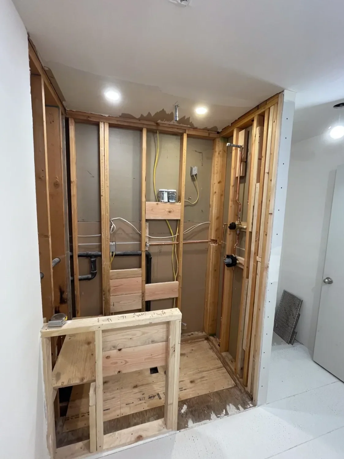 Bathroom under construction during a remodel featuring progress on wood shower frame build in Boulder, CO