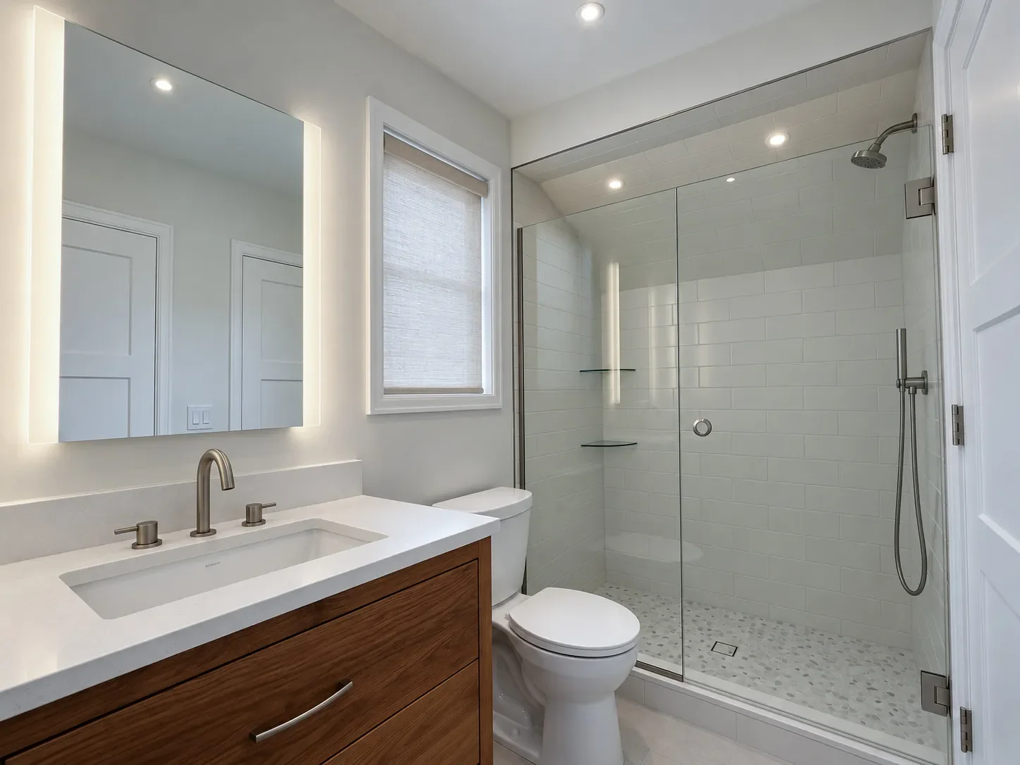 Newly remodeled minimal contemporary style bathroom in Noble Park, Boulder, CO with reclaimed barnwood vanity, white quartz countertop, LED mirrors, frameless glass walk-in shower, and linen texture look ceramic floor tiles.