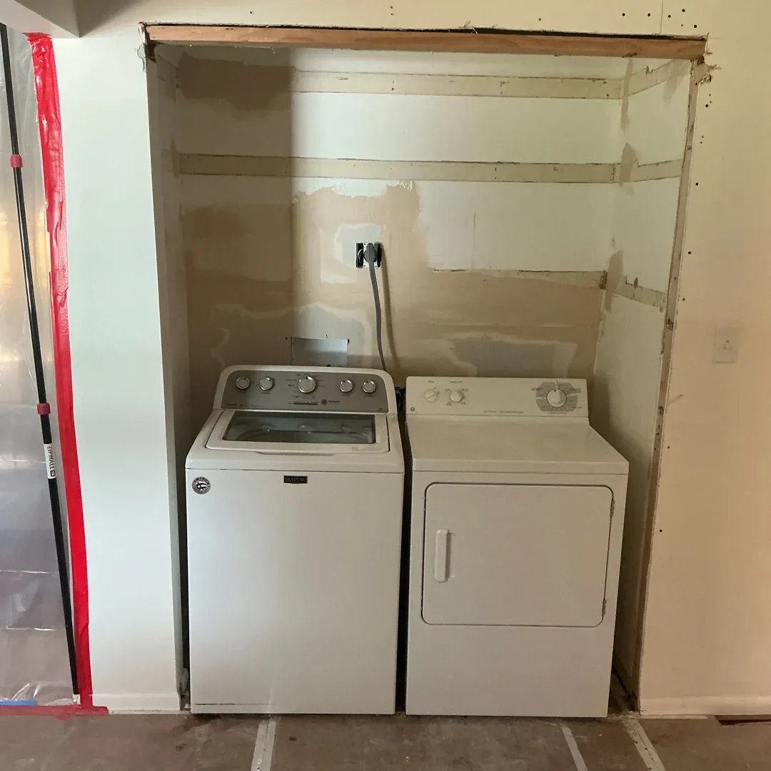 View of previous laundry closet interior before being remodeled in a Longmont, CO home remodel.