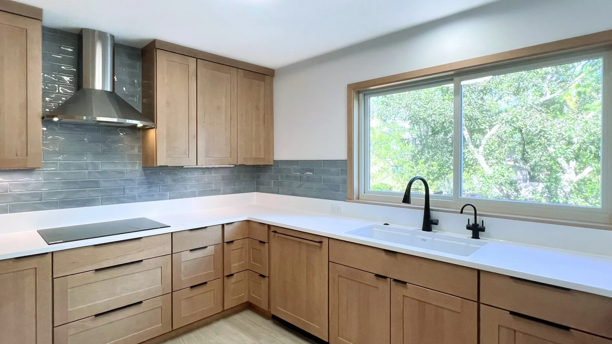 A contemporary craftsman kitchen with custom cabinets in a home remodeled by Downy Home Remodeling with a class B contractors license in Boulder, CO