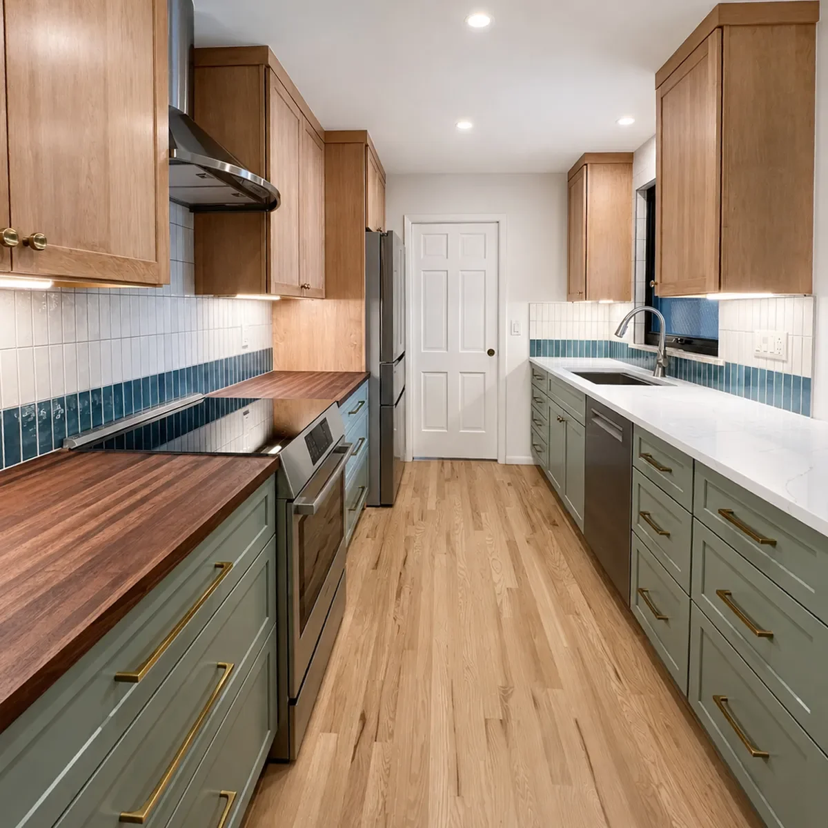 Transitional craftsman kitchen remodel with red oak hardwood floors, maple upper cabinets, green lower cabinets, white quartz and dark walnut countertops, and stainless steel appliances in Longmont, CO