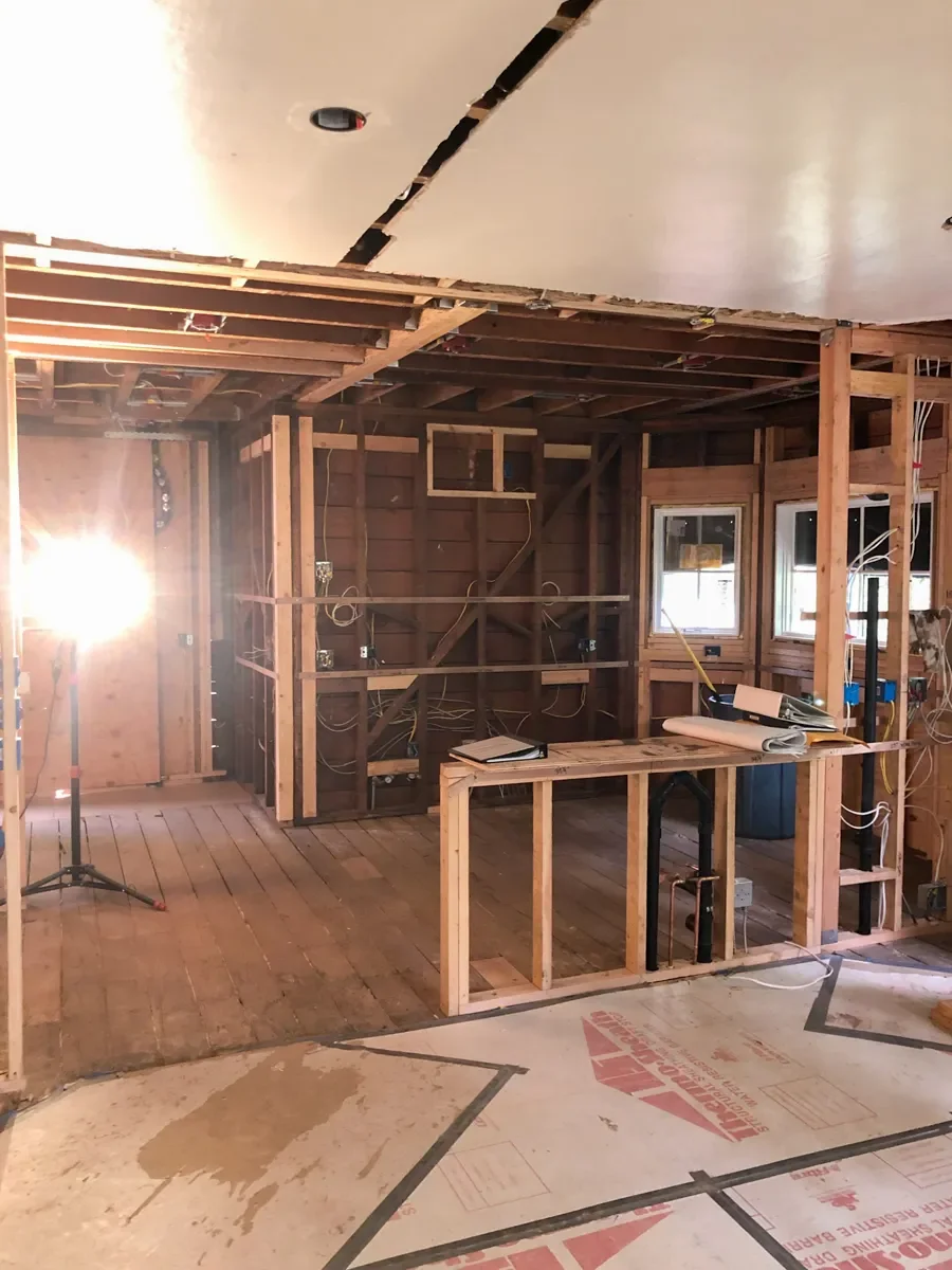 Unfinished kitchen remodel under construction in Louisville, CO featuring freshly framed new open layout floorplan design