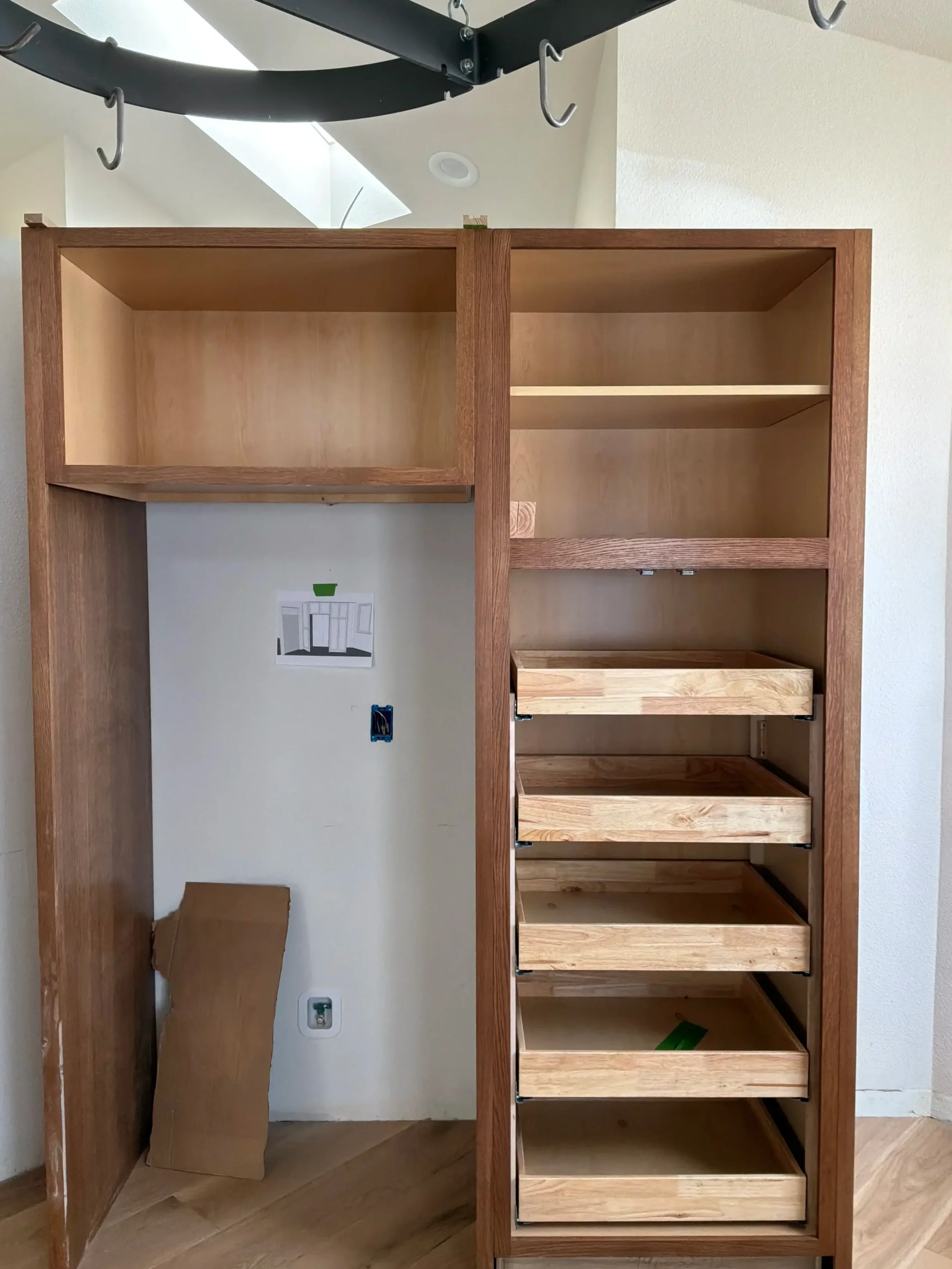 Gunbarrel, CO kitchen remodel in progress featuring partially built custom cabinets with pull-out drawer storage