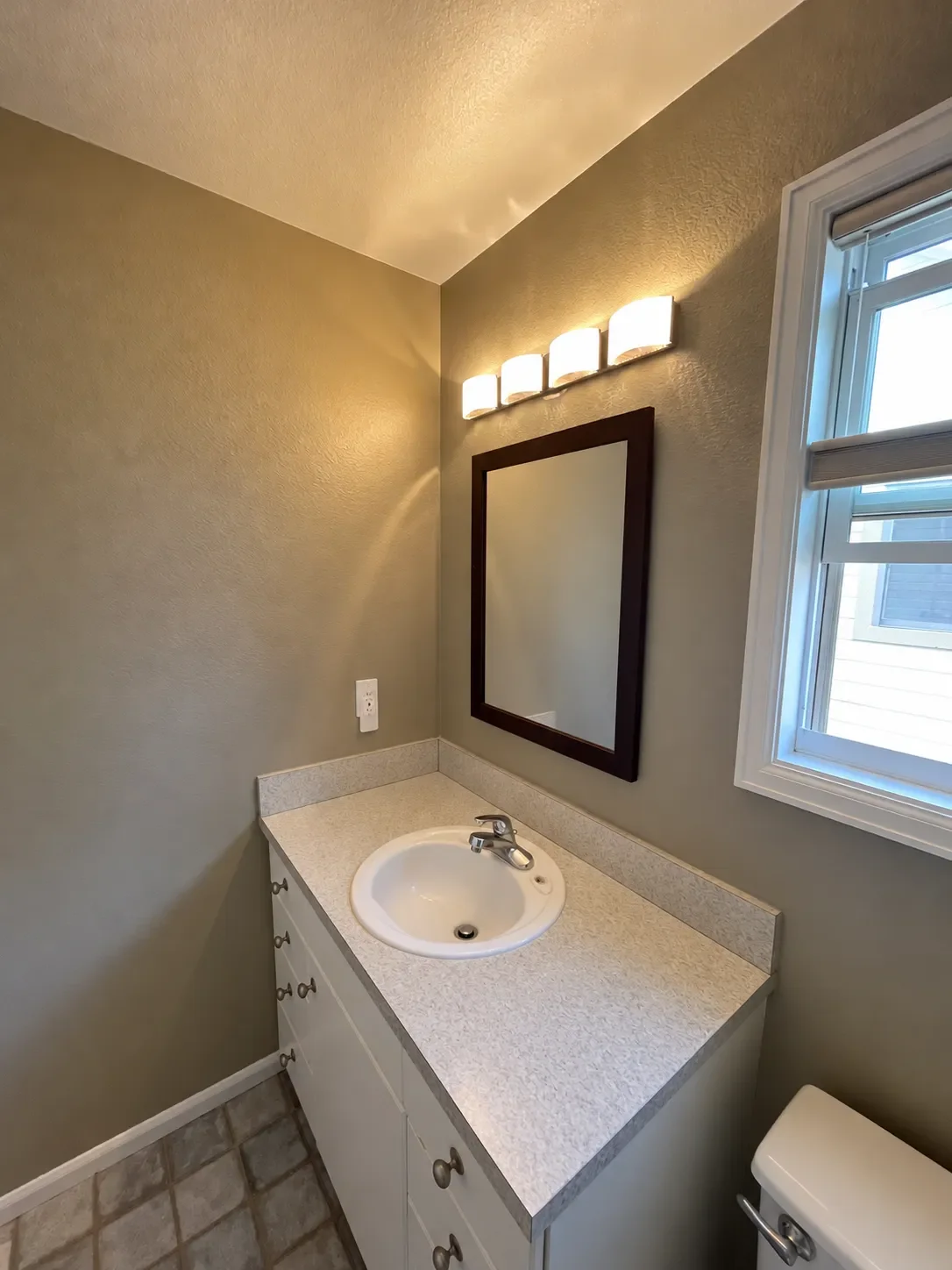 View of vanity with laminate countertop in a before photo of a bathroom awaiting remodel in Noble Park, Boulder, CO