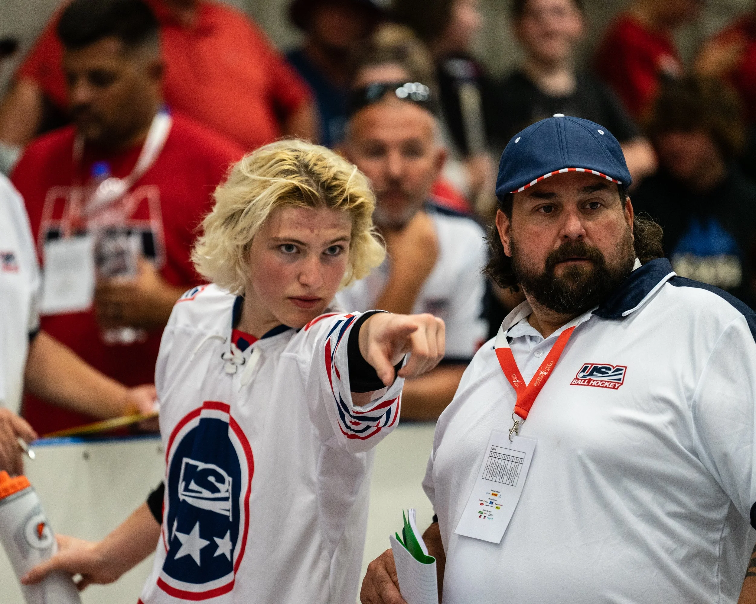 Joey Moore points something out to Coach Rennebeck during a period break