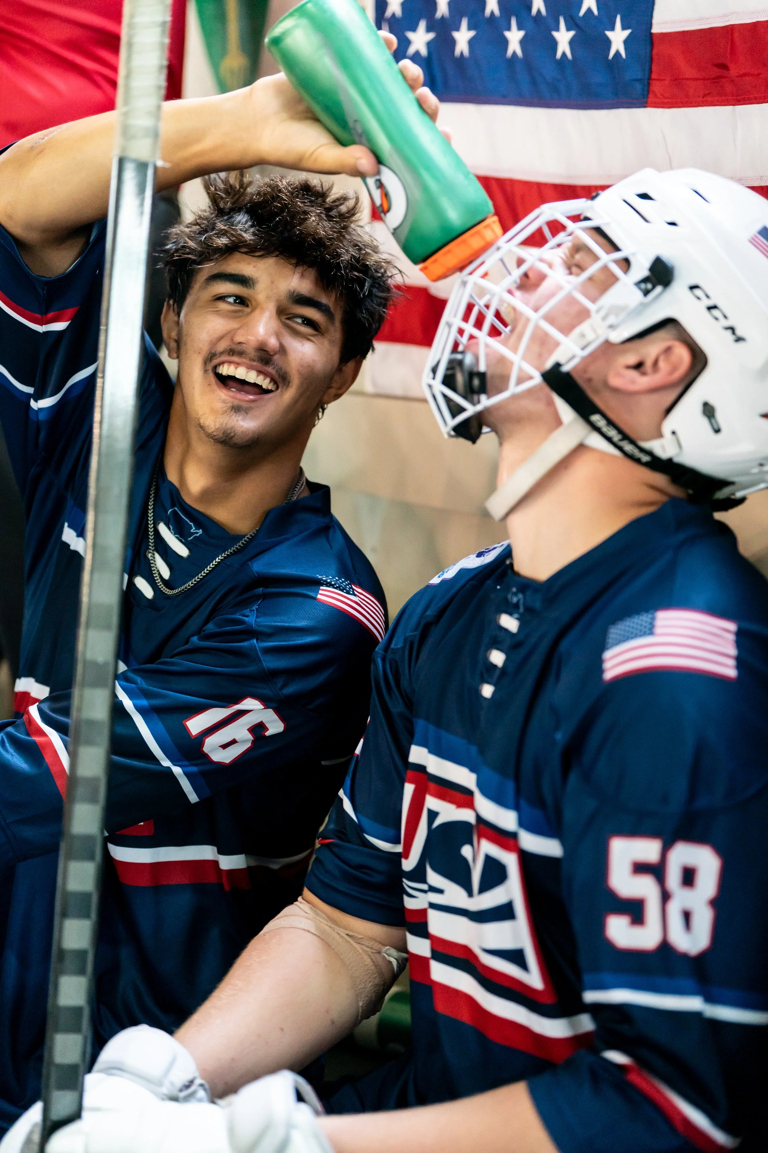 Leo Impagliazzo gives Dom Rennebeck a drink during a light moment against Great Britain