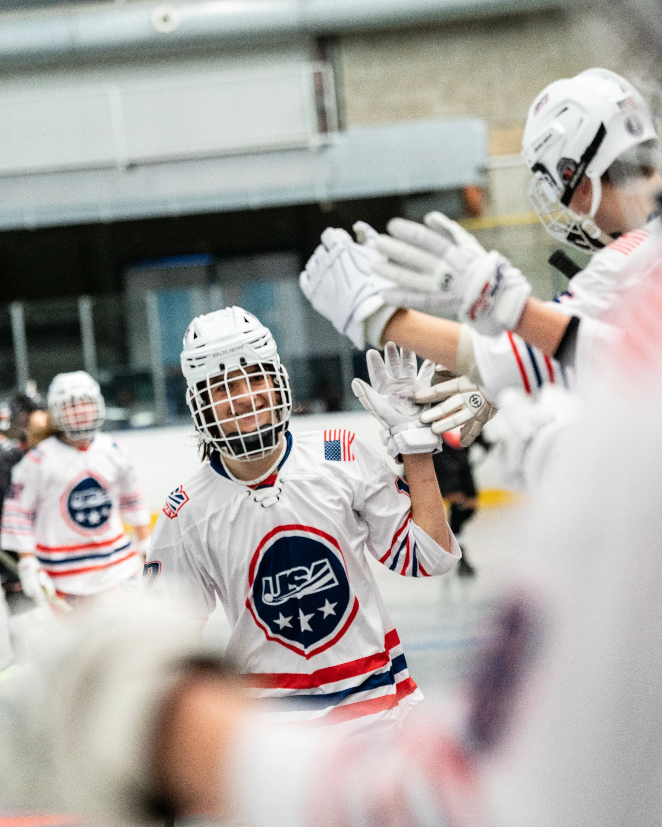 Kaden Byington leads the high-five line after he scores a big goal