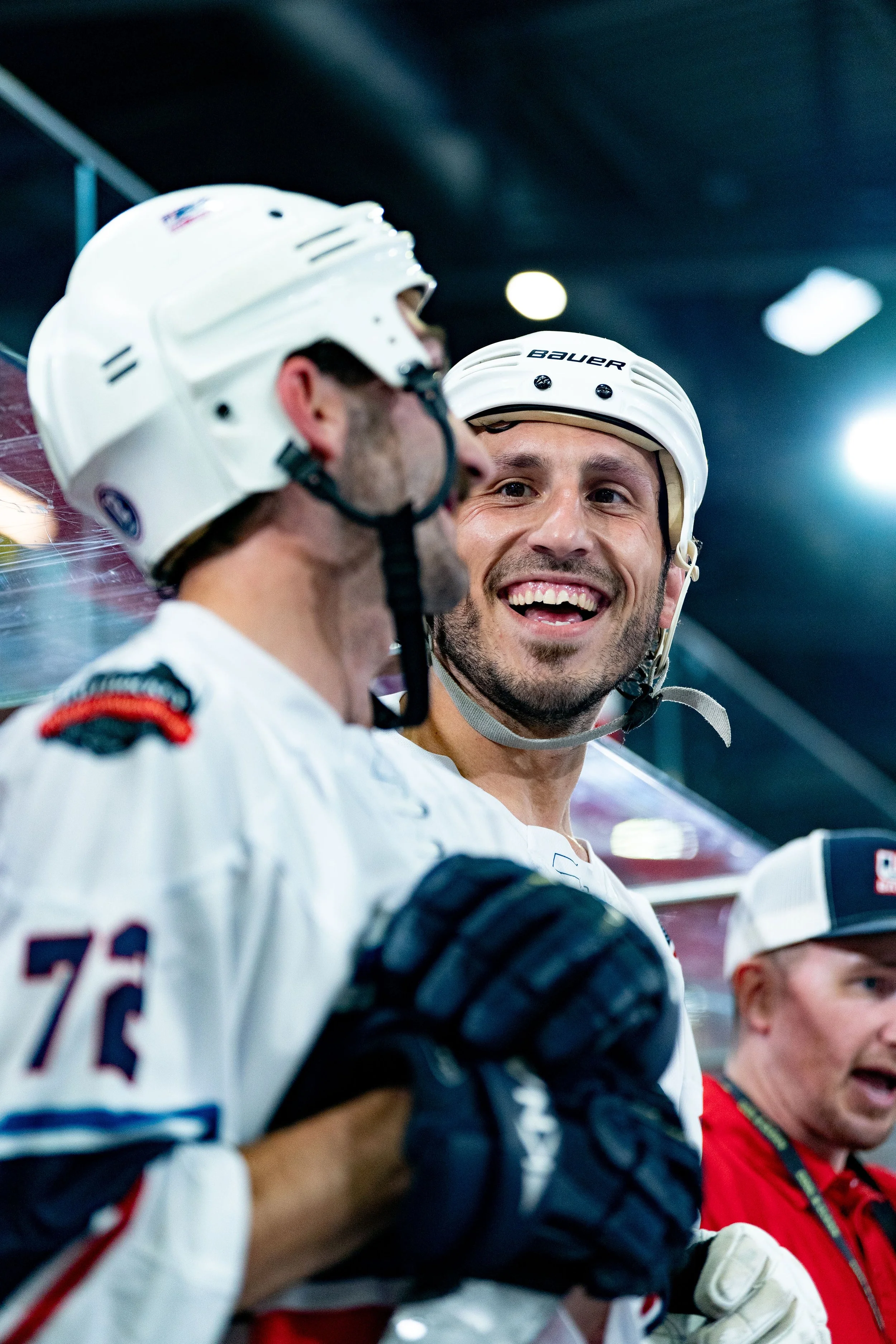 Longtime friends Brandon Jones and Korey Wilson share a smile on the bench