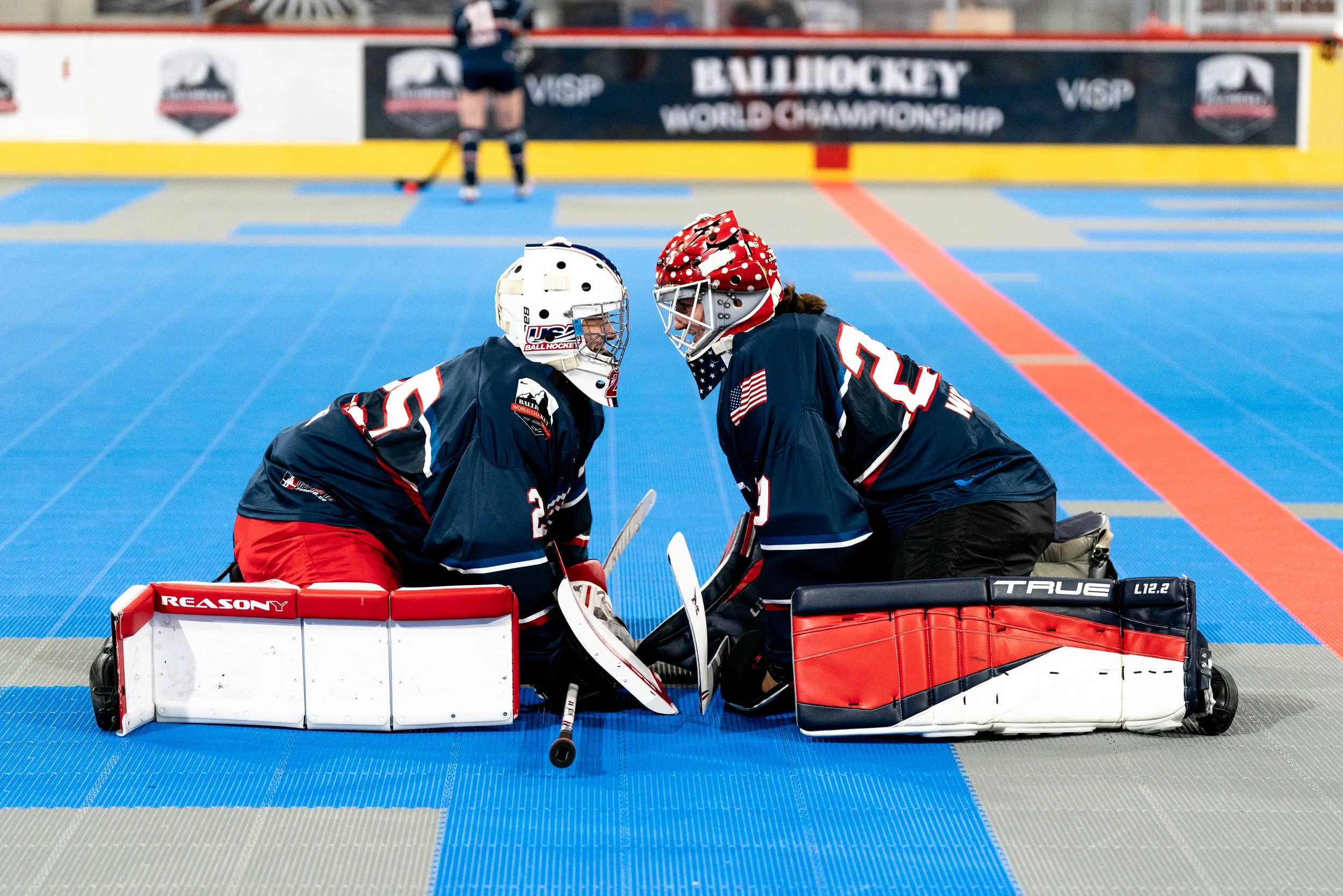 Maxie Weiss and Brooke Wolejko encourage each other in pregame warmups