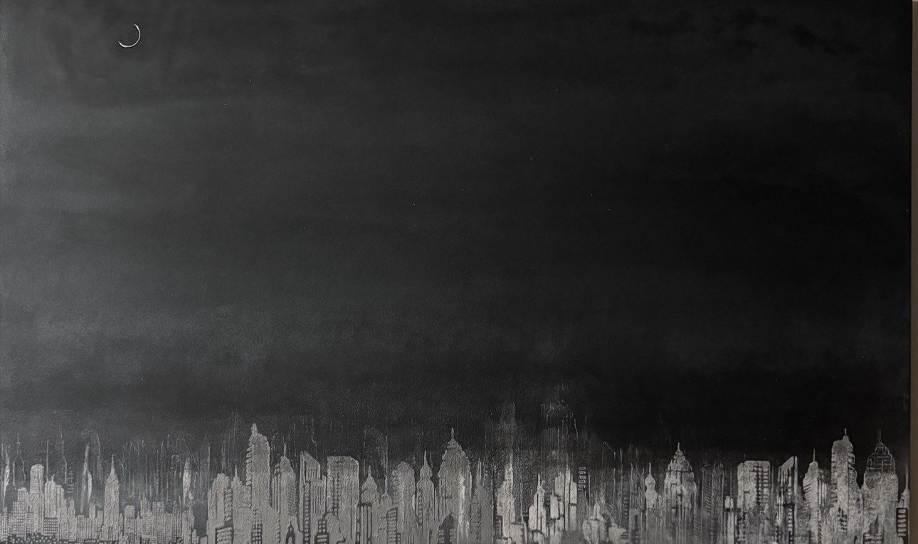 Nighttime city skyline silhouette with dark sky and distant moon.