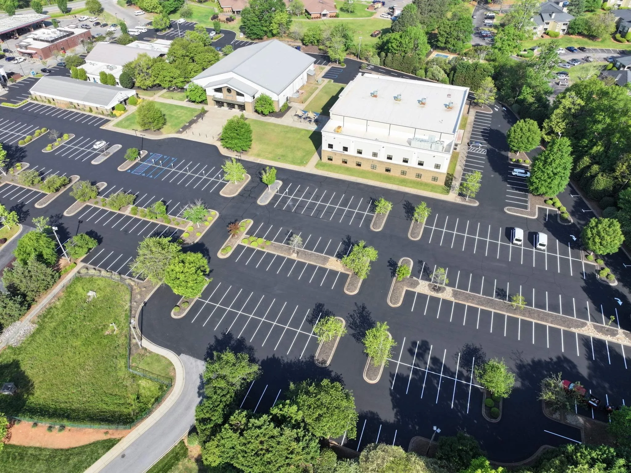 newly sealcoated asphalt parking lot and resriping lines at a church in Greenville, SC
