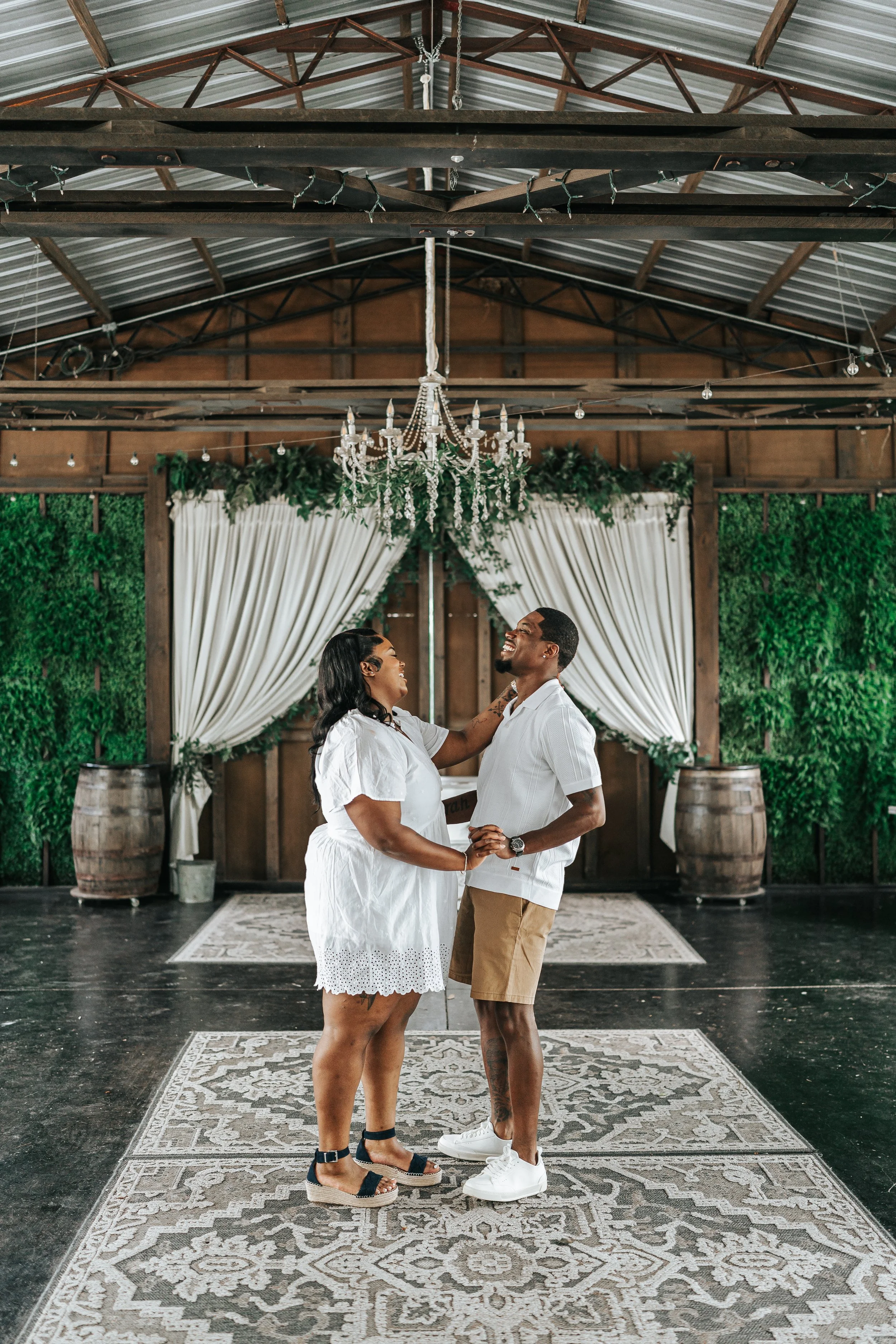 Bride and groom african american, black dancing first dance under a dreamy chandelier