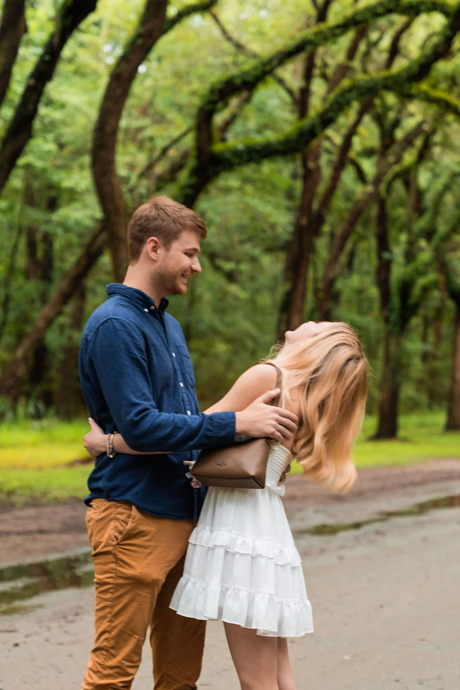 couple getting engaged at wormsloe historic savannah ga future bride laughing.jpg