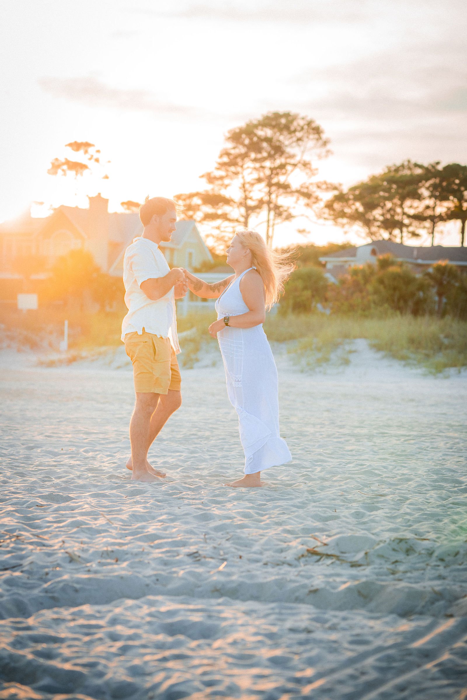newly engaged couple dancing in beach hilton head sc.jpg