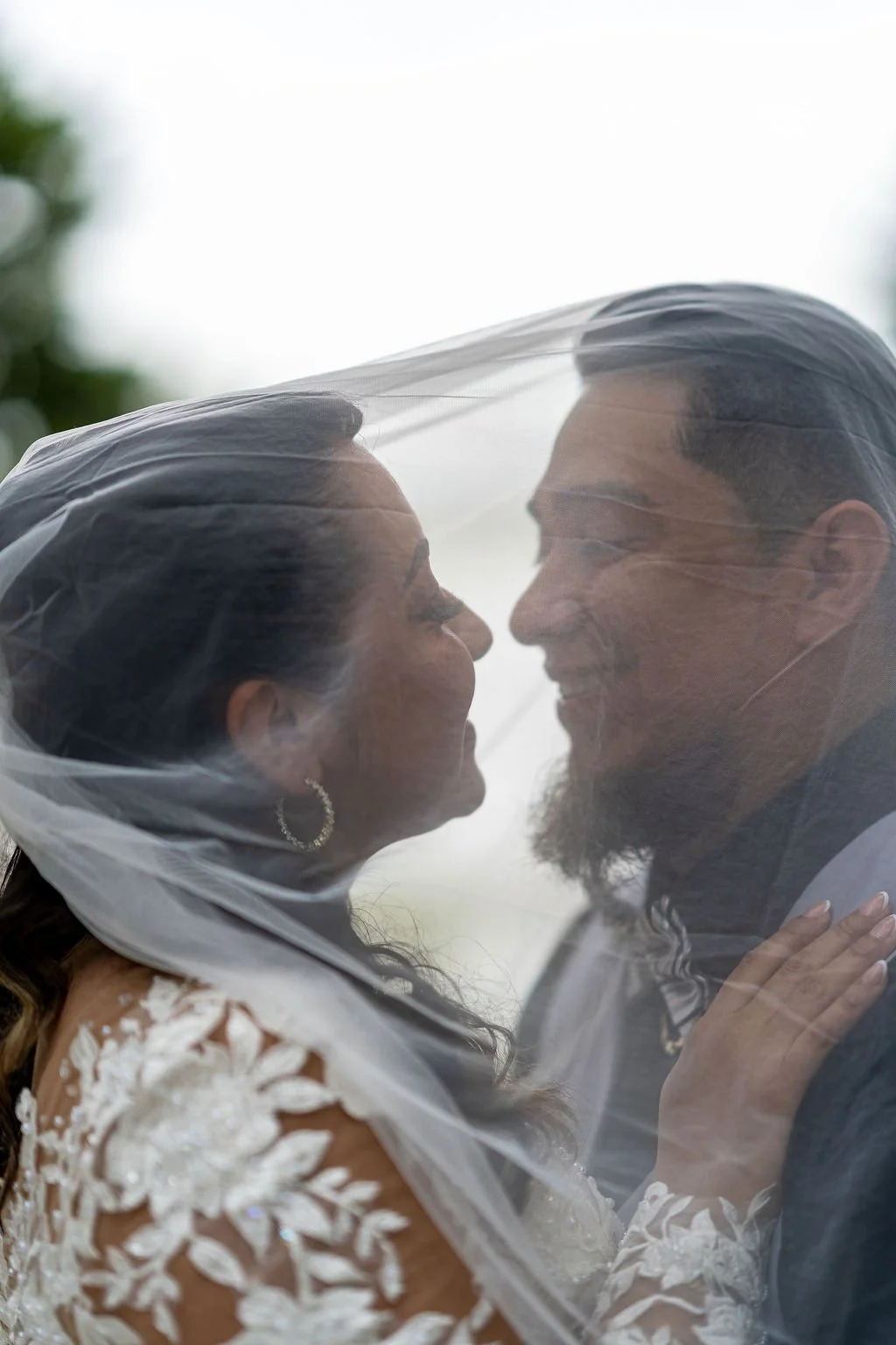 bride and groom under veil close up shot at oyster factory park in bluffton, sc