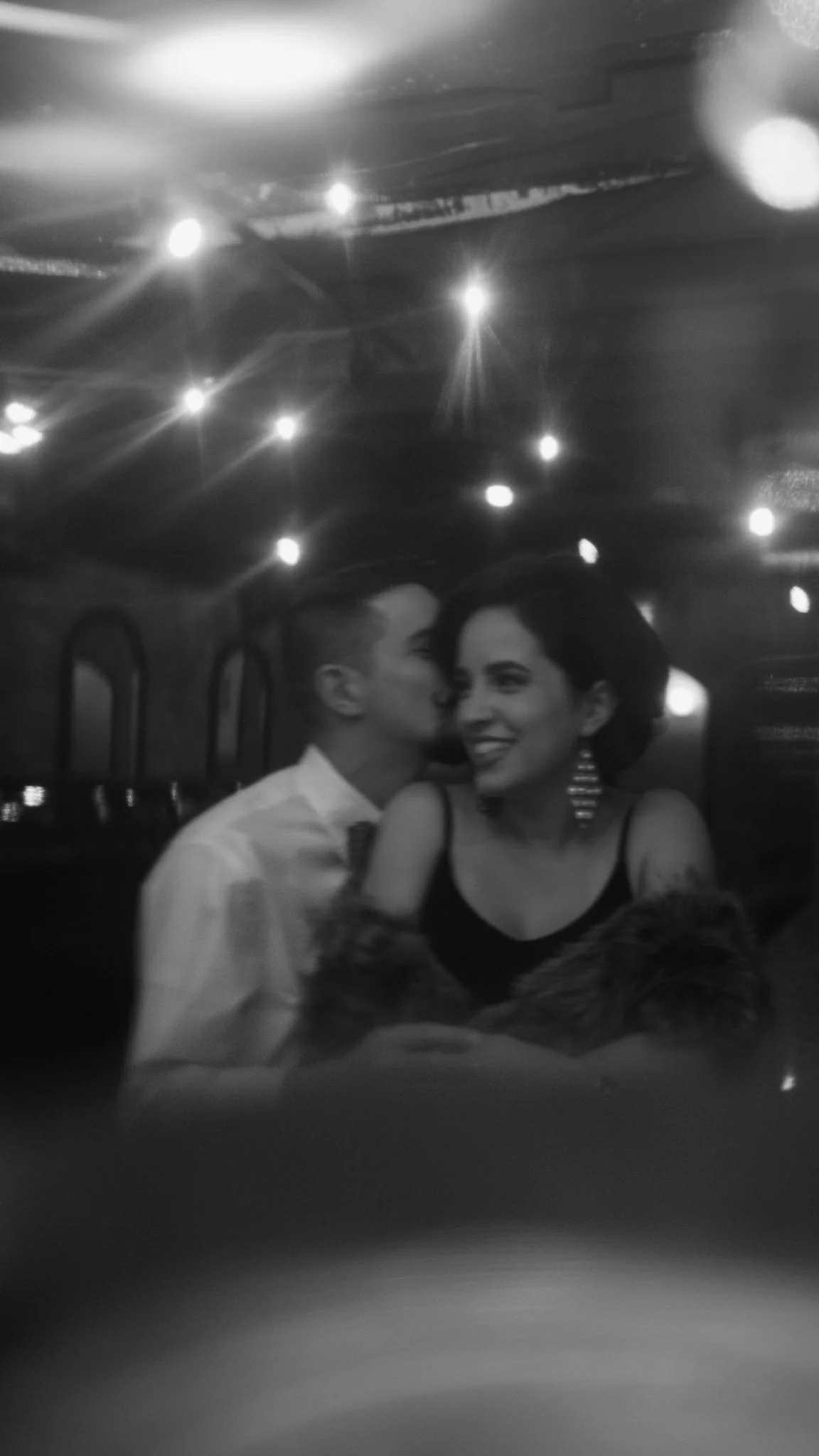 Couple anniversary session on rooftop at Churchill’s on Bay Savannah GA overlooking historic downtown skyline"